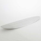 Accelerator SurfboardsのMID 7'0" HOMYモデル。ライトグレーのPU素材を使用したミッドレングスサーフボード。